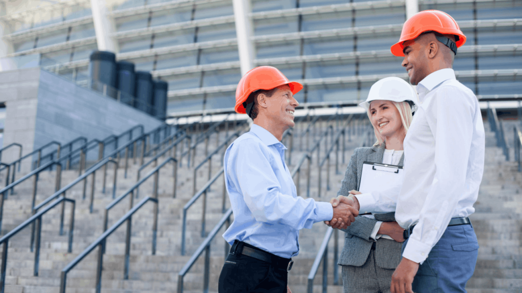 Contractors shaking hands with client after securing exclusive contractor leads for new project