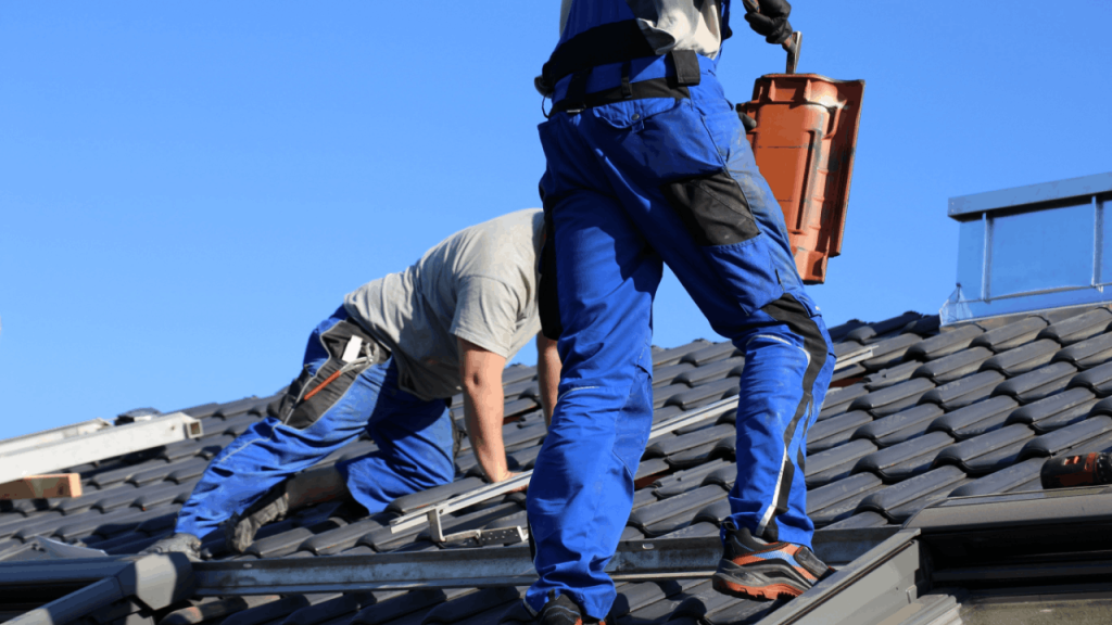 Professional roofing contractors installing tiles on a residential roof to generate quality roofing leads through expert service delivery